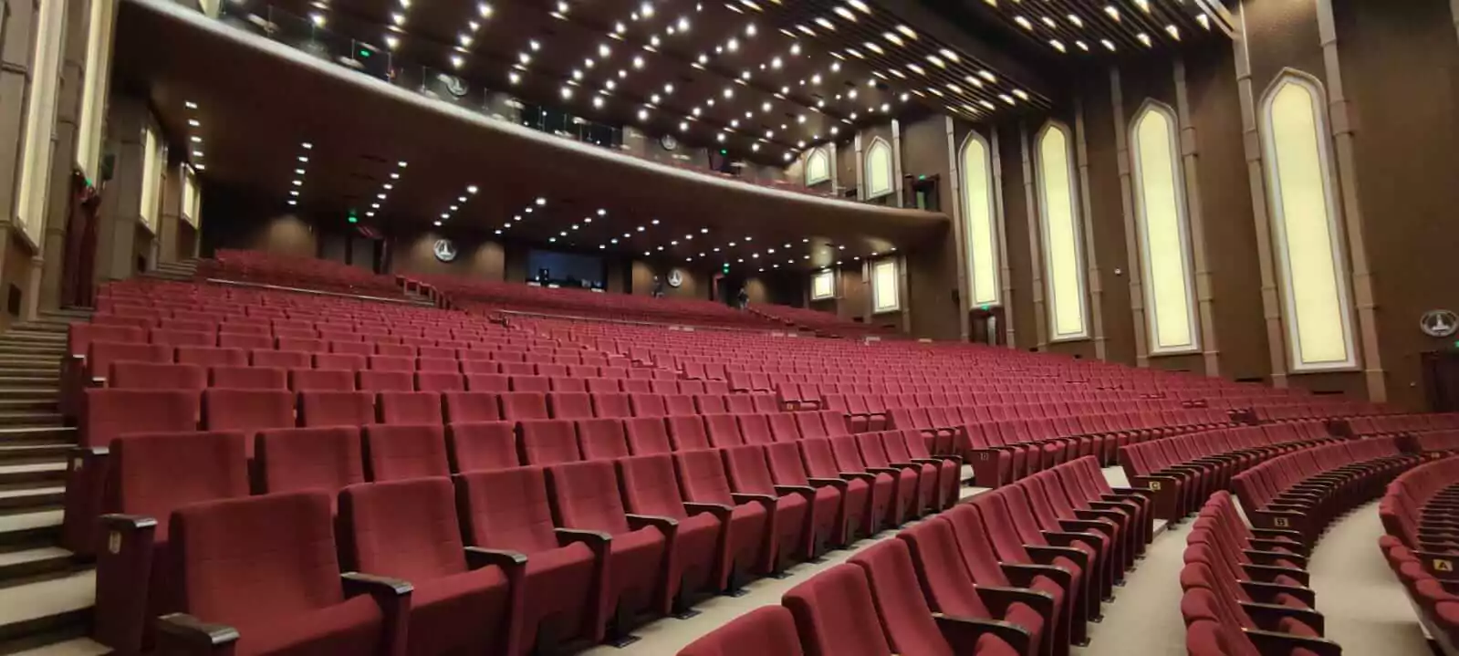 Auditorium seating with writing tablets Image